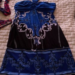 Strapless long top; shelf bra; ties behind neck Cachet